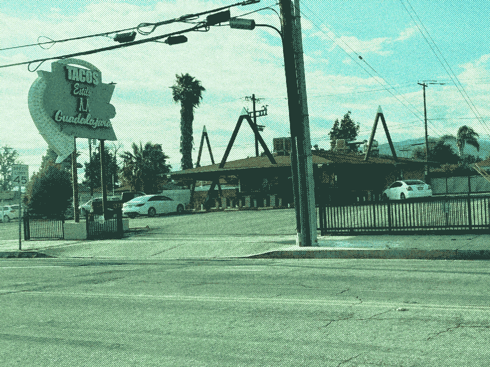 Tacos Estilo Guadalajara, a round building with spiky columns extending high above its roofline